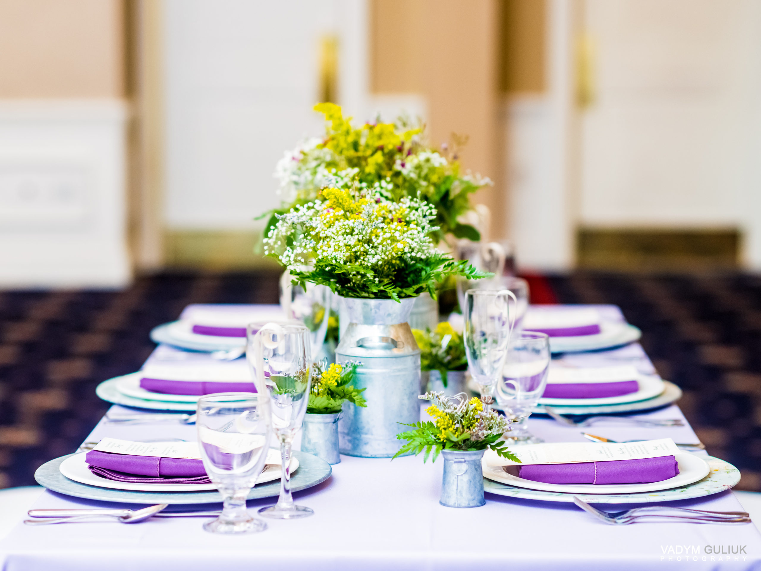 bright greenery and purple table display