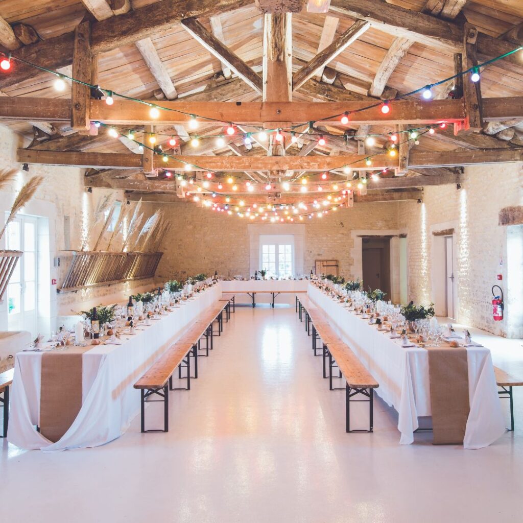 A venue decorated with tables and lights.